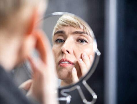 Skin,Aging,Concept.,Middle-aged,Lady,Looking,In,Round,Mirror,At